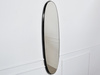 Owalne lustro w czarnej ramie 36x136x3,5 cm 12F-378